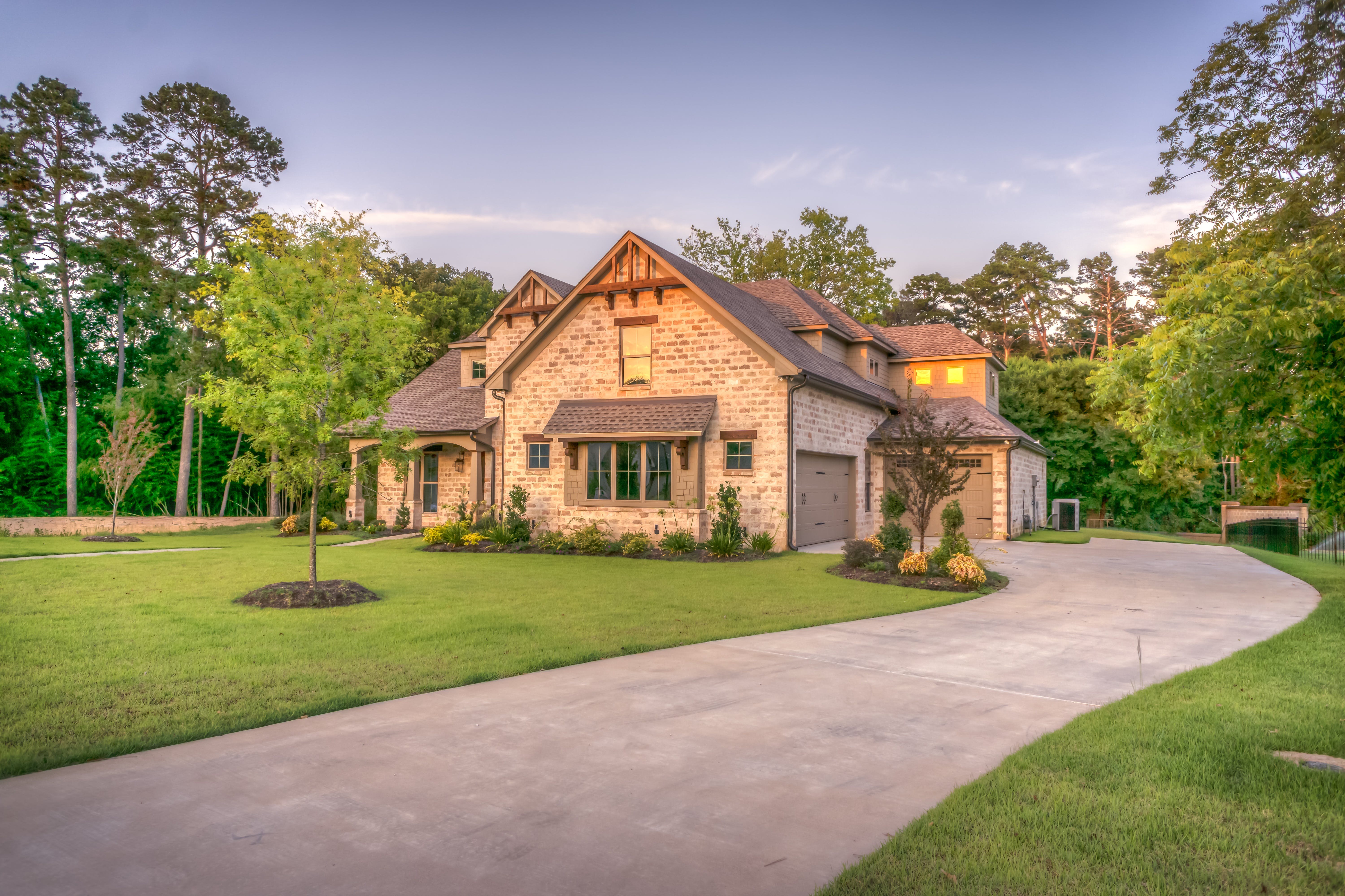 Image of a house with a large driveway